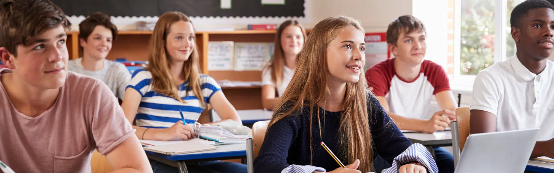 Young students sitting in class